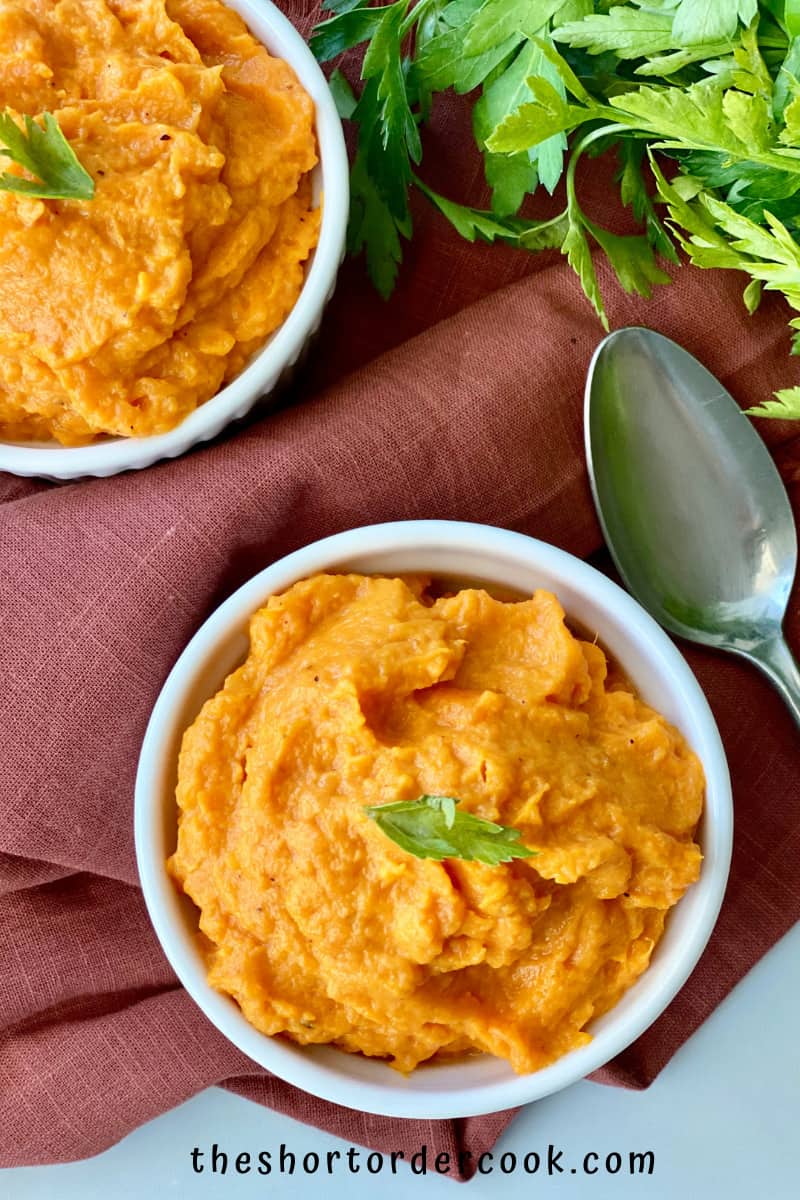 Whipped Sweet Potatoes ready to eat overhead image of ramekins filled plus spoon and red napkin