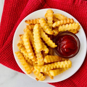 Air Fryer Frozen Crinkle French Fries recipe card plate with ketchup ready to eat