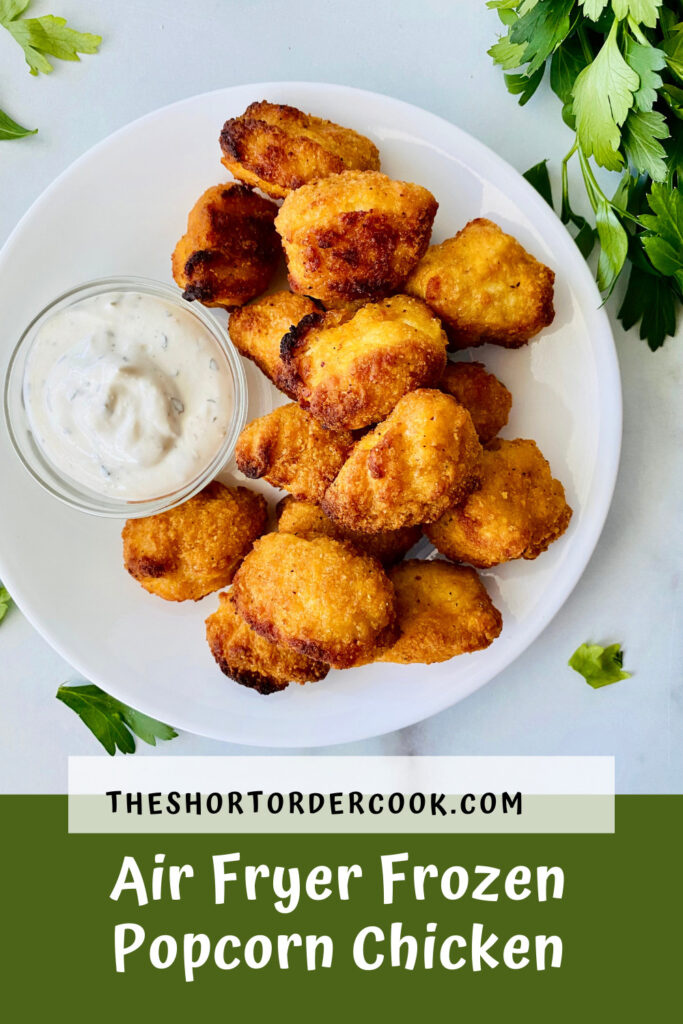 Air Fryer Frozen Popcorn Chicken PIN plated with ranch dressing and fresh parsley