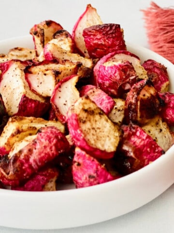 Crispy Air Fryer Keto Radishes featured side view of tiny plate with food ready to eat