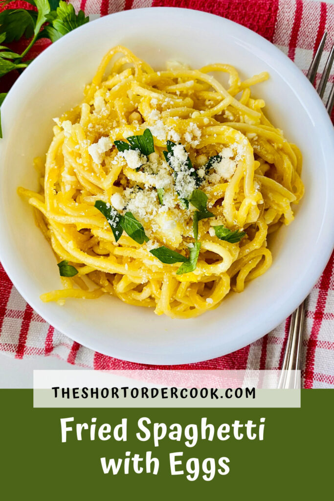 Fried Spaghetti with Eggs PIN bowl of pasta ready to eat topped with grated parmesan and fresh parsley flakes