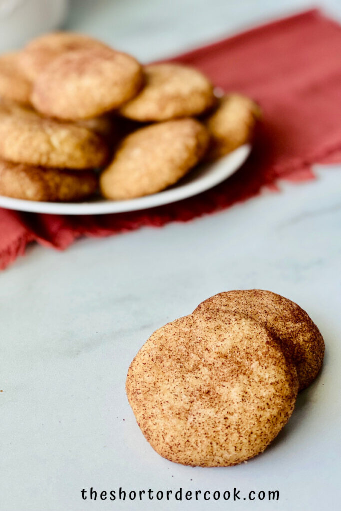 Snickerdoodles without Cream of Tartar plated and a few on the counter ready to eat