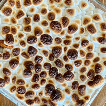 Sweet Potato Marshmallow Casserole featured overhead square casserole dish with toasted marshmallows on top