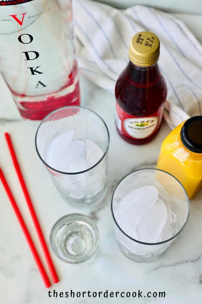 Vodka Sunrise overhead of ingredients and two glasses with ice