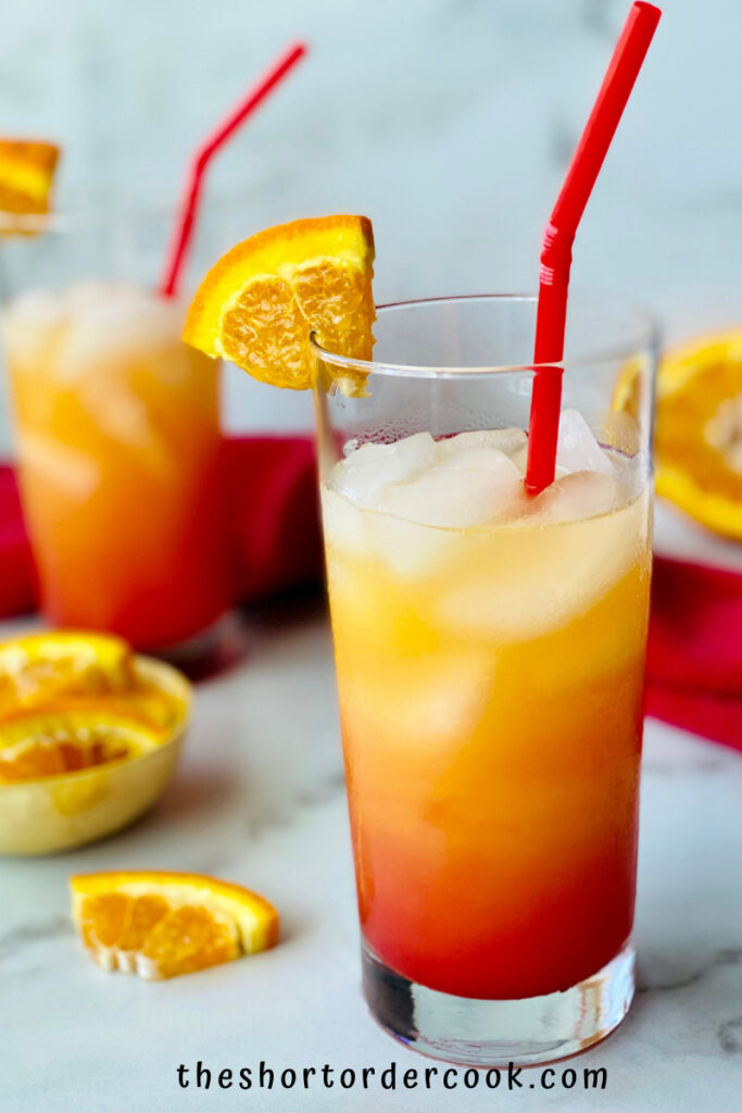 Vodka Sunrise two glasses ready to drink with orange wedge garnish and red straws