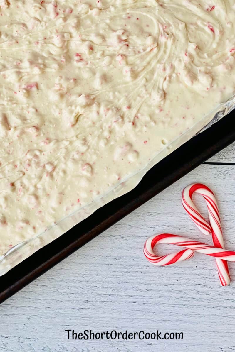 2-Ingredient Peppermint Bark spread in the sheet pan cooling to set up