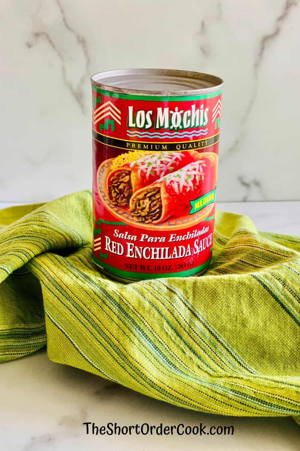 Best Store-Bought Enchilada Sauce can of red enchilada sauce and green cloth napkin