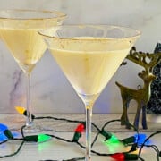 Eggnog Vodka Martini with lights and deer and mini xmas trees