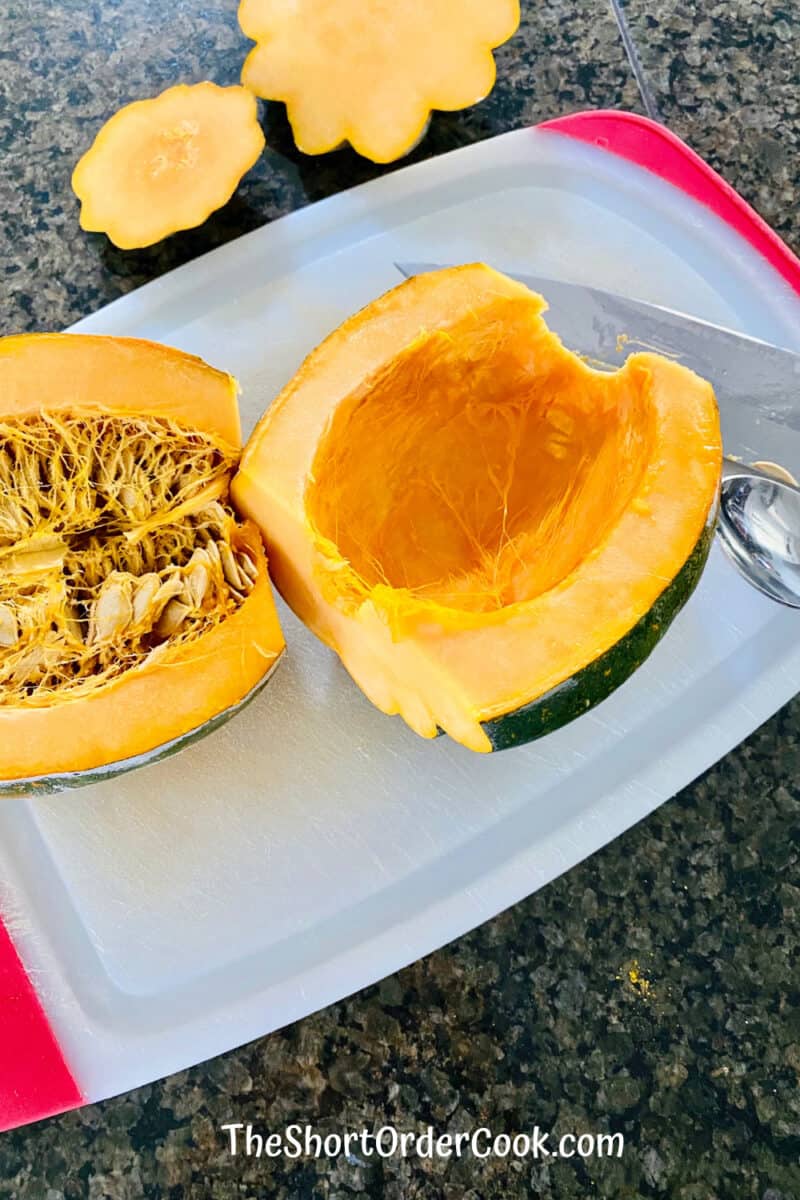 Air Fryer Curried Acorn Squash Slices cut in half with seeds scooped out of one half