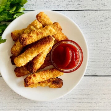 Air Fryer Frozen Fish Sticks recipe card plated fish sticks with a small bowl of ketchup