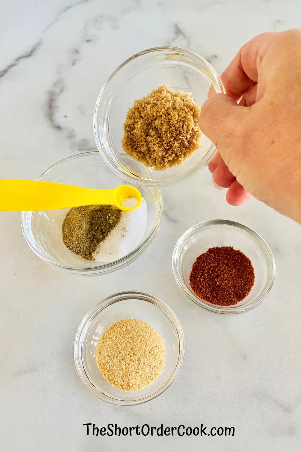adding spices to one small bowl