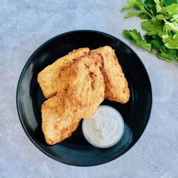 air fried breaded fish on a plate with ranch dip