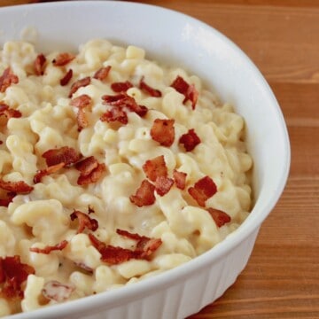 casserole dish with baked 3 cheese mac and cheese topped with bacon