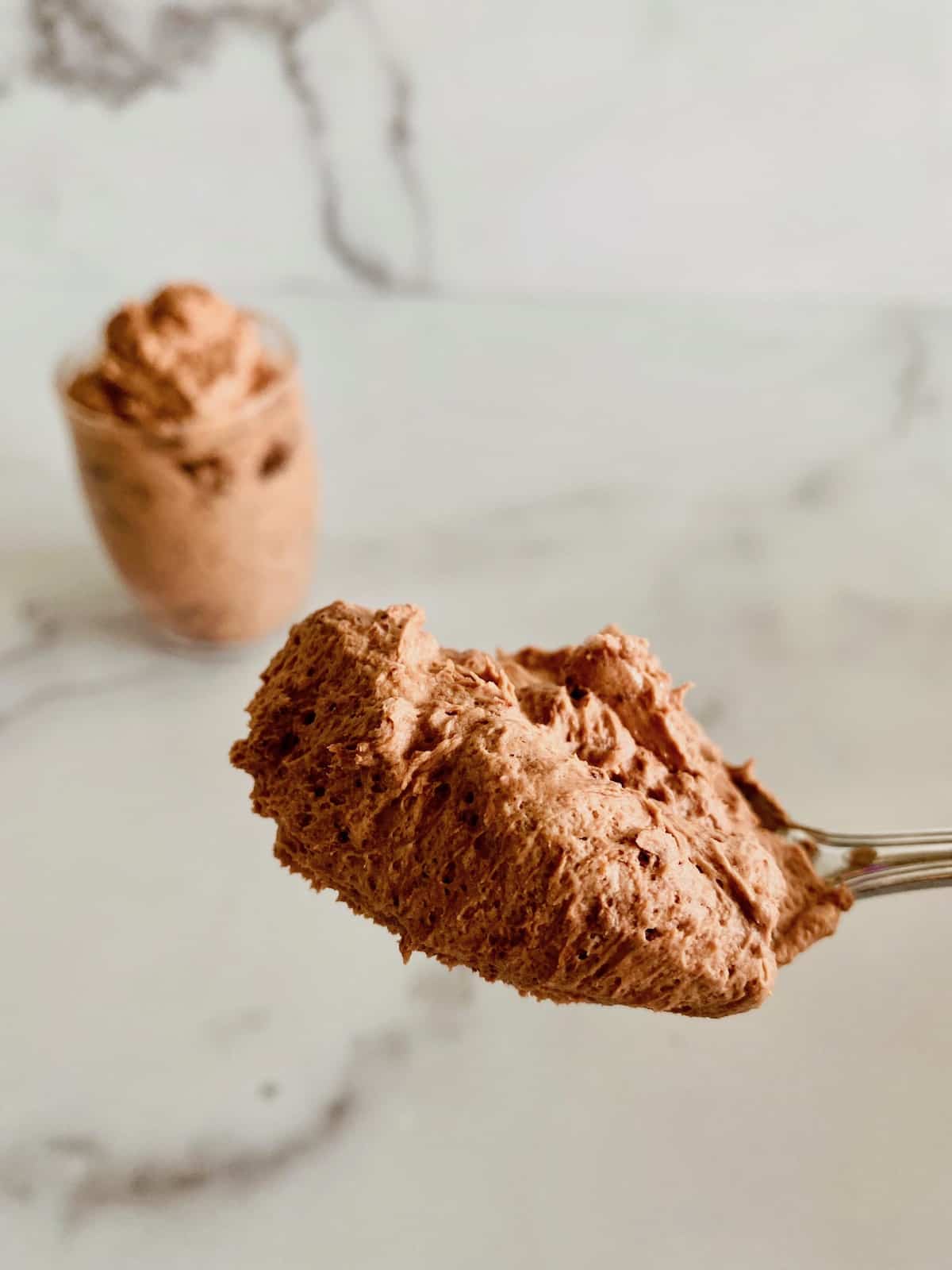 Easy Low-Carb Chocolate Mousse scooped on a spoon close up