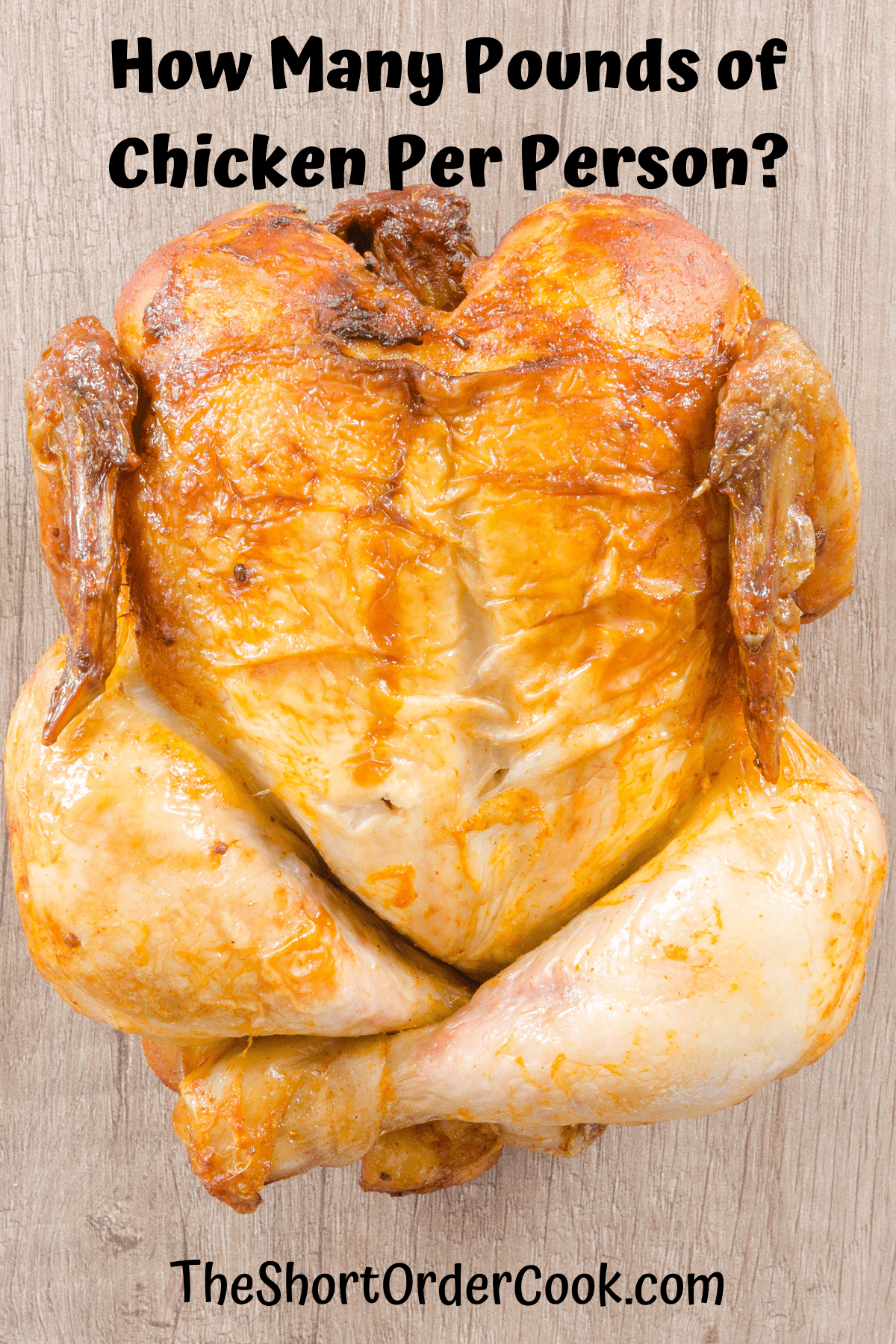 a whole roasted chicken on a cutting board ready to carve