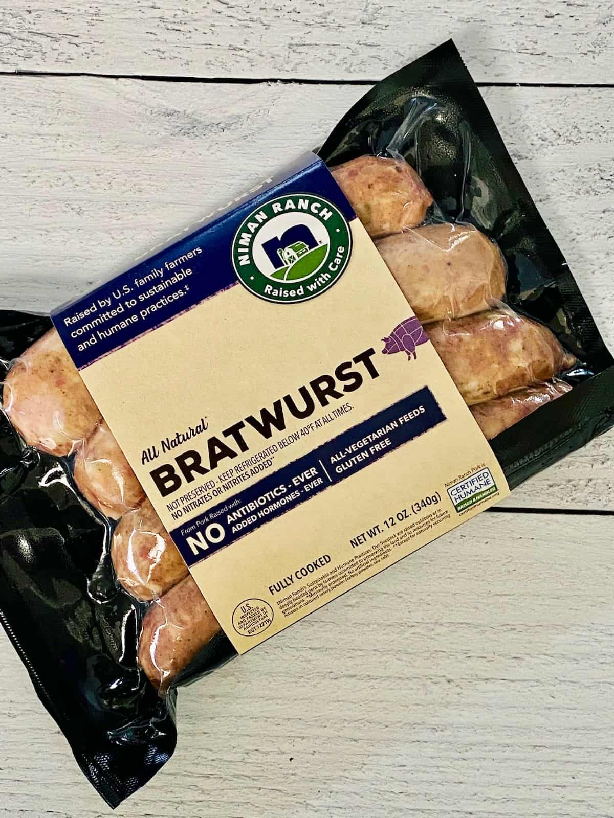 a packed of bratwurst on a wood table