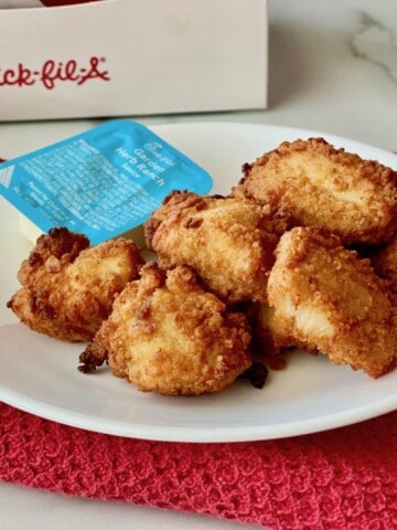 Reheated Chick-fil-a Nuggets on a plate ready to eat