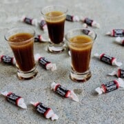 3 shot glasses filled ready to drink and tootsie rolls candies