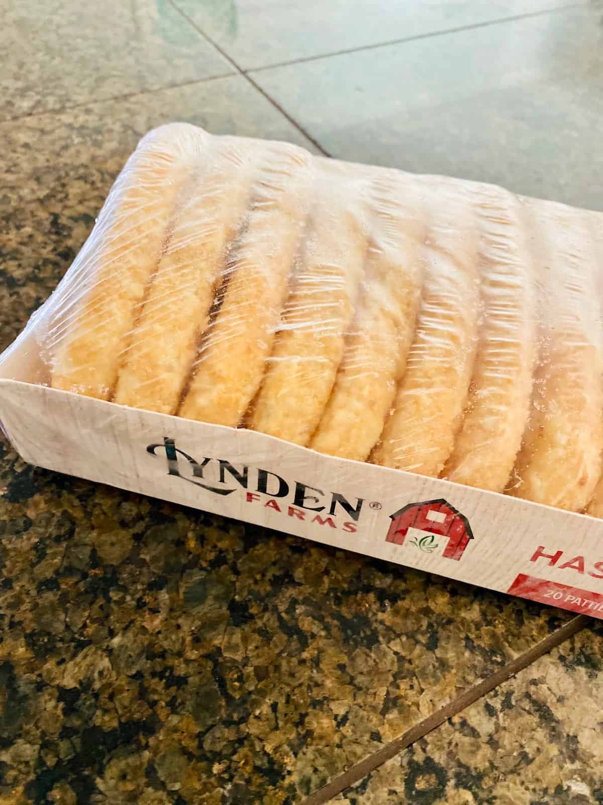 a wrapped package of frozen hash brown patties on a table