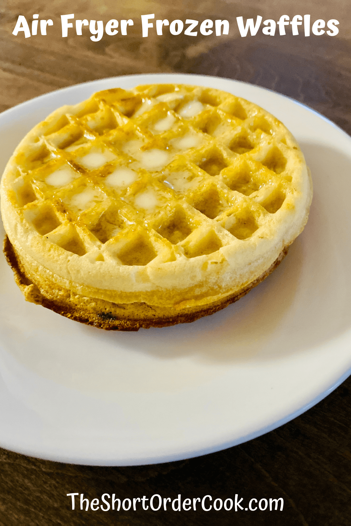 two waffles ready to eat with melting butter on top and plated