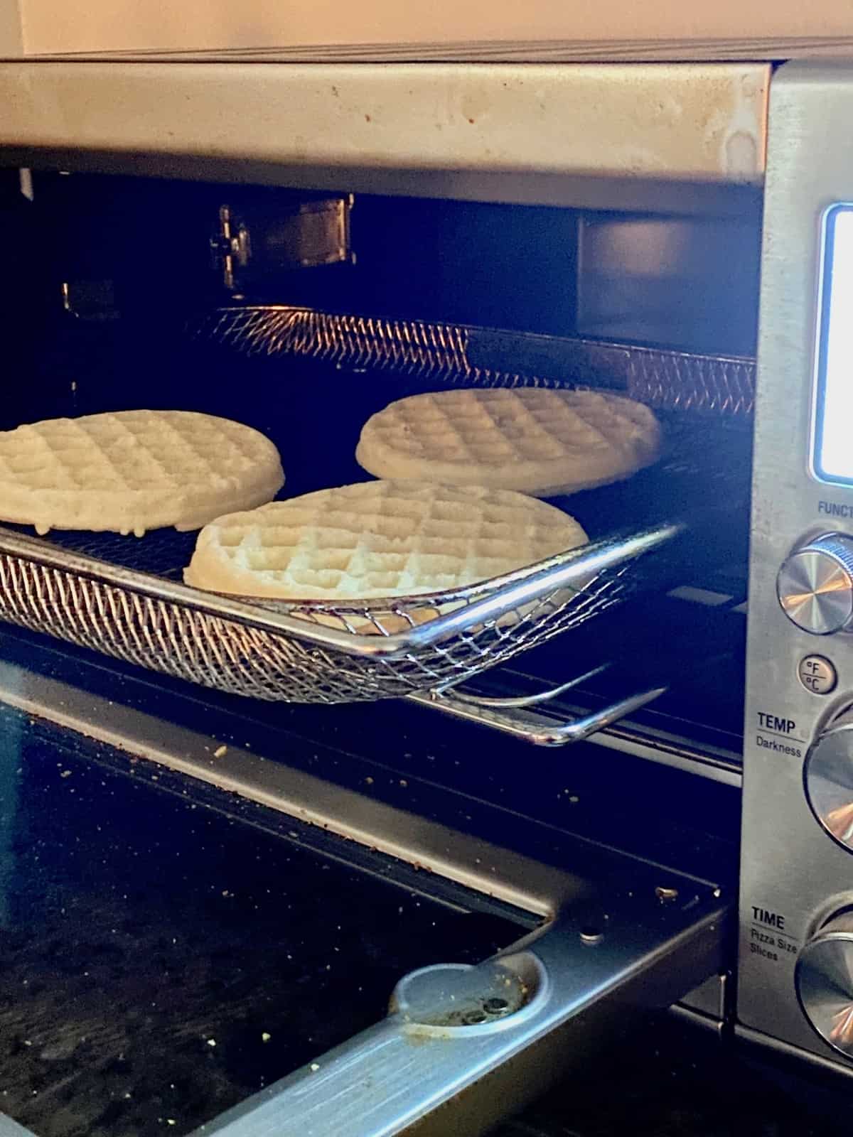 frozen waffles places on the air fryer tray