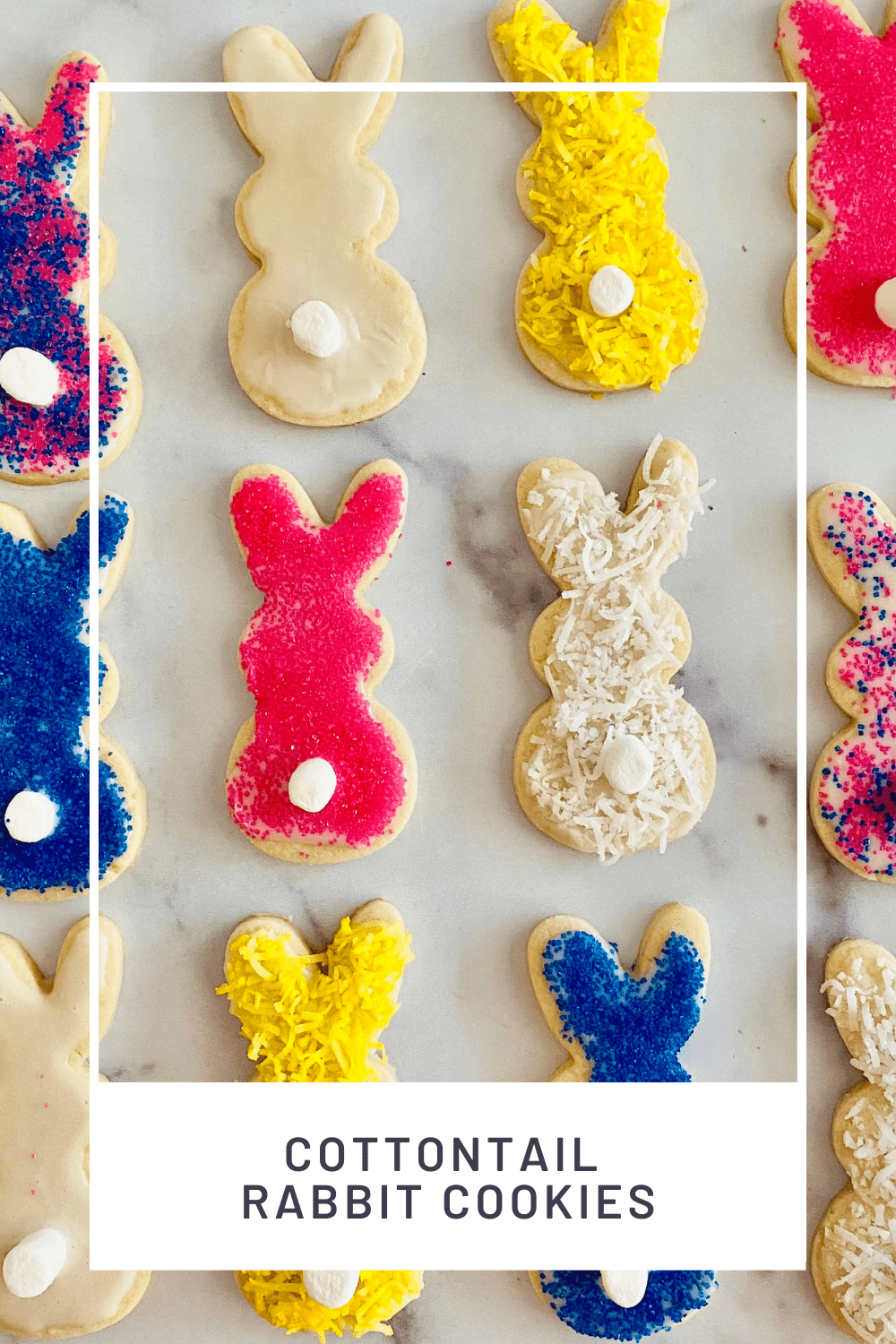 Bunny shaped sugar cookies with marshmallow tails and decorated with colored sugar and coconut.
