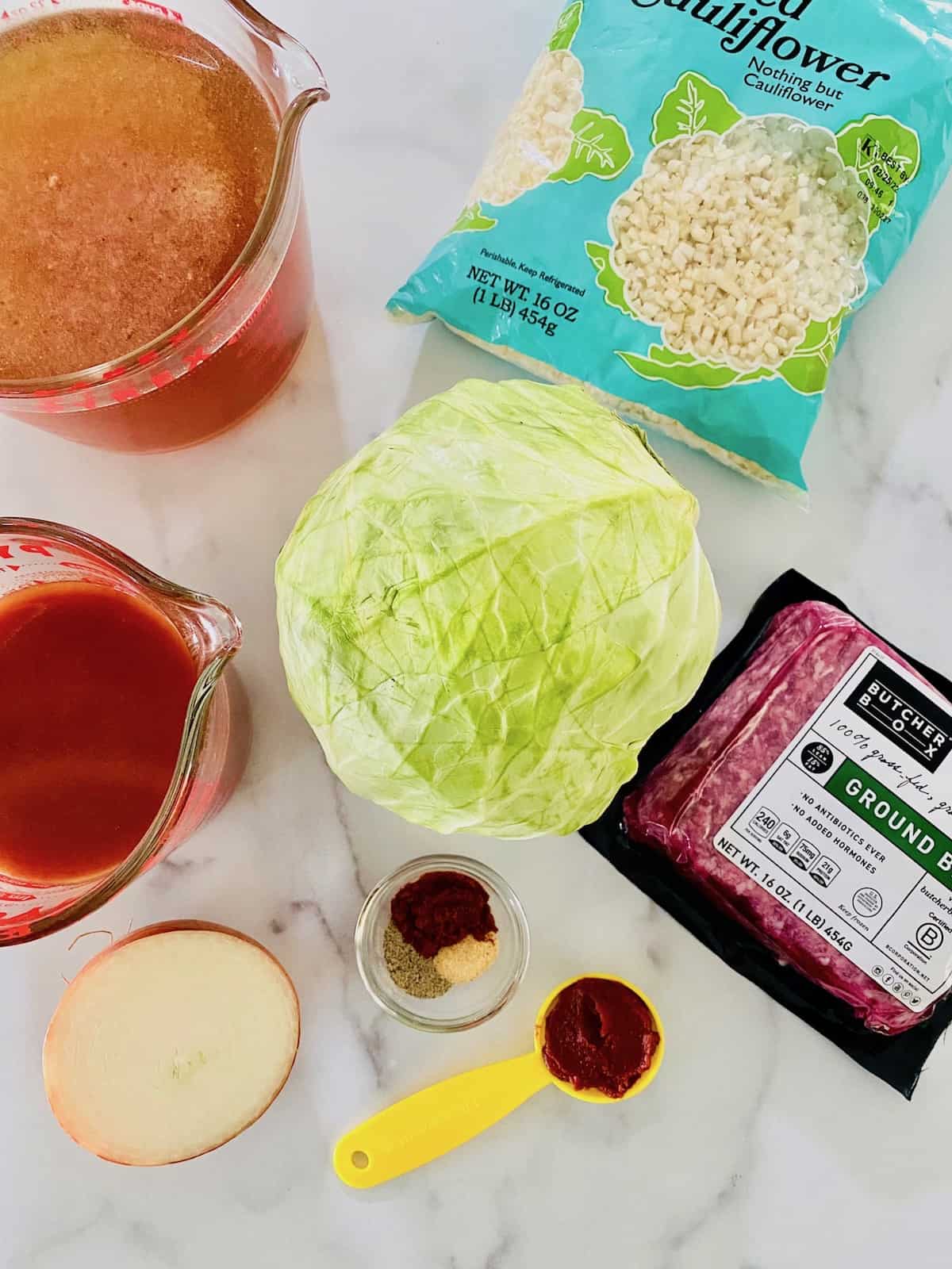 ingredients on a table for making slow cooker cabbage roll soup