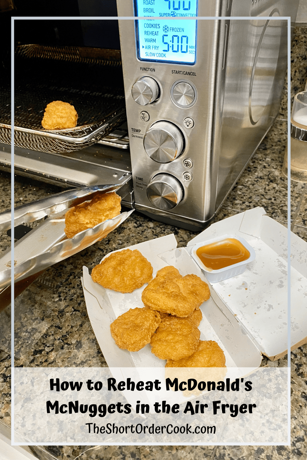 Nuggets being removed from the air fryer with tongs.