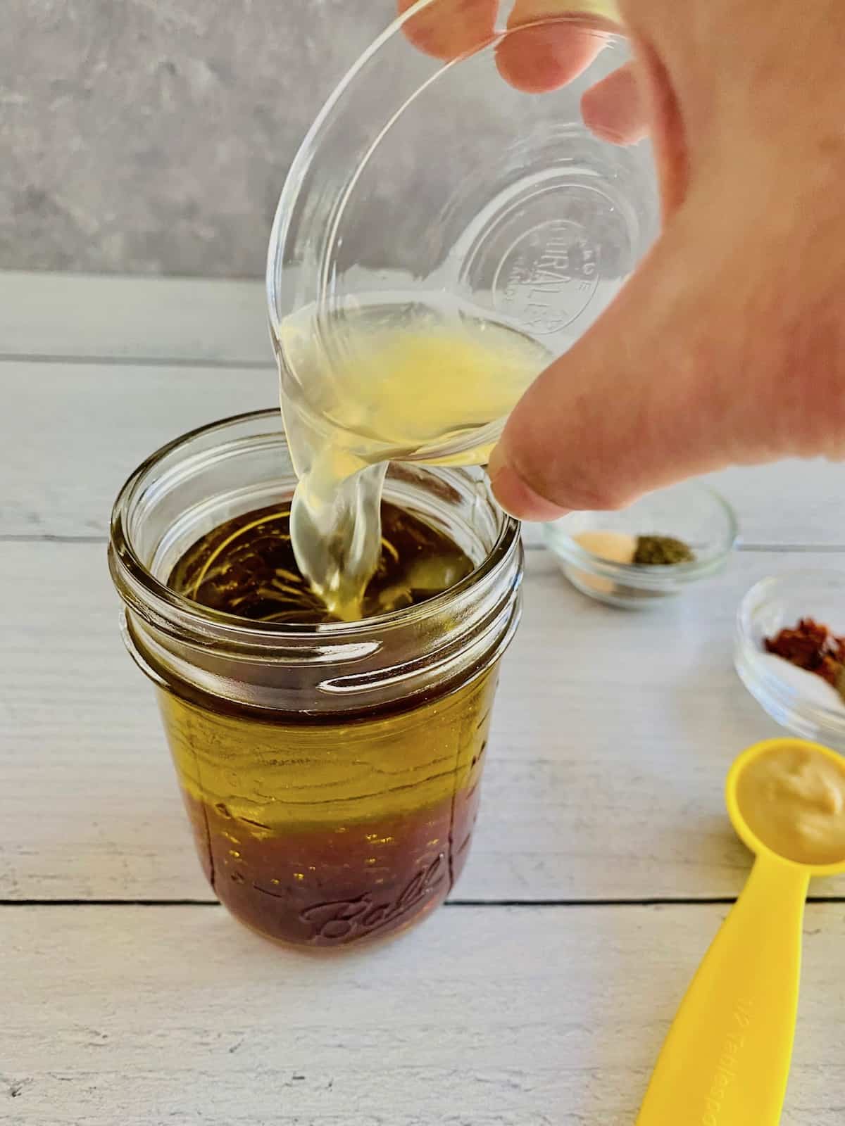 Adding lemon juice to oil and vinegar