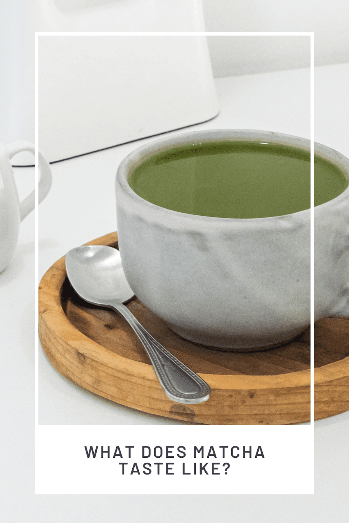 a white tea cup filled with green matcha tea.