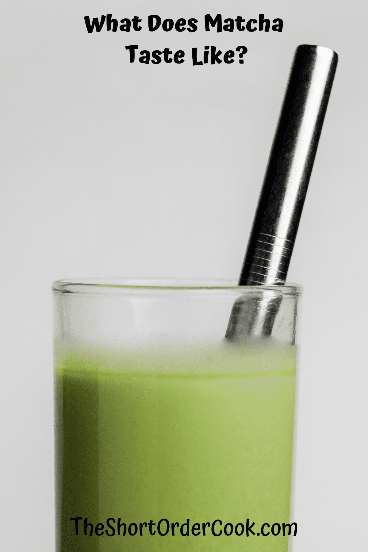 a glass full of green tea matcha with a straw.