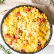 Overhead image of round casserole dish with baked ham and cheese casserol