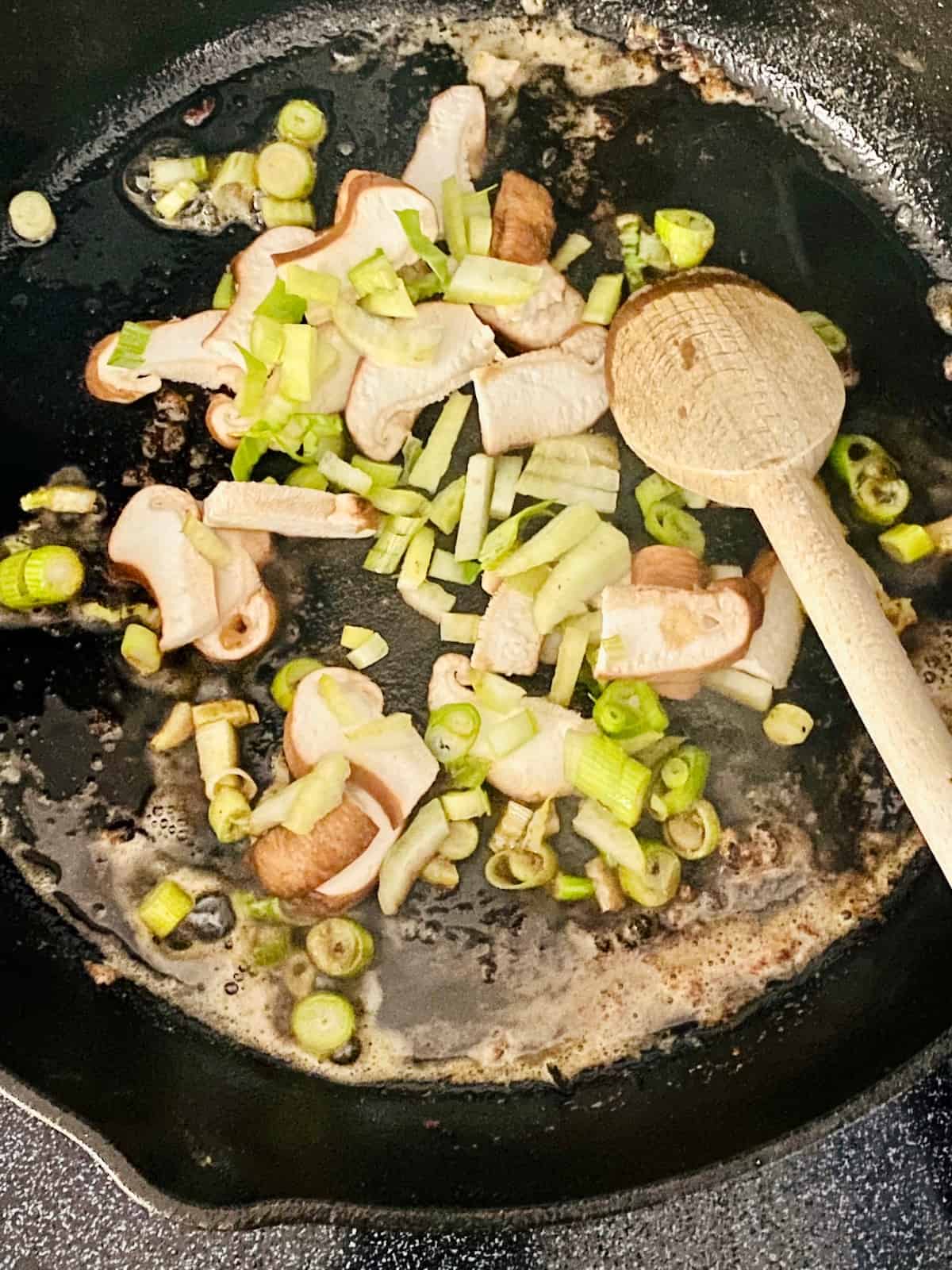 Add vegetables to melted butter in cast iron.