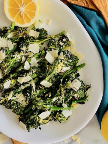 Air Fryer broccolini plated with lemon and parmesan.