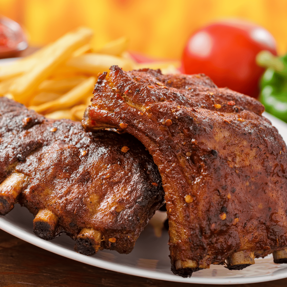 A plate of ribs ready to eat.