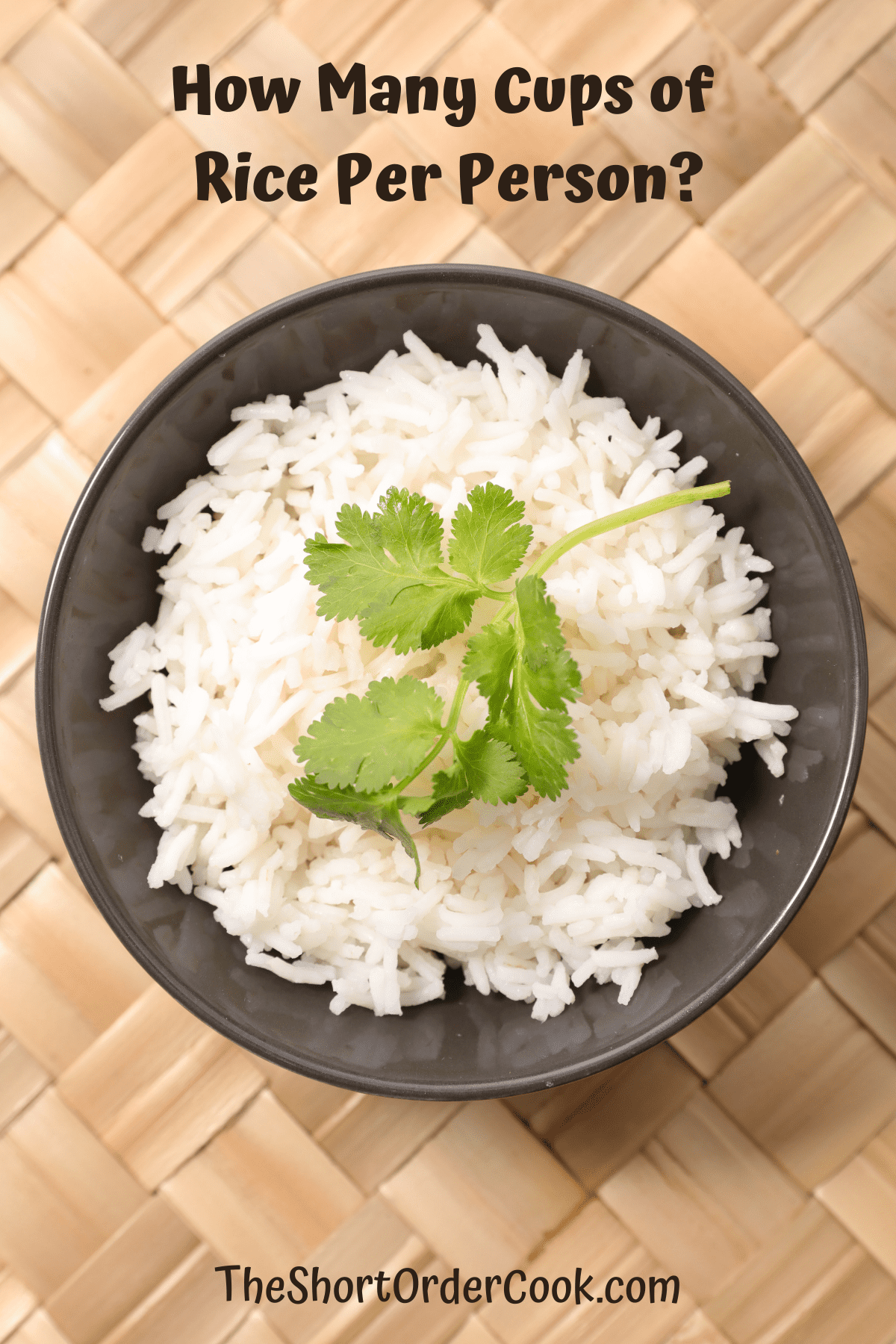A black bowl filled with white rice and topped with cilantro.
