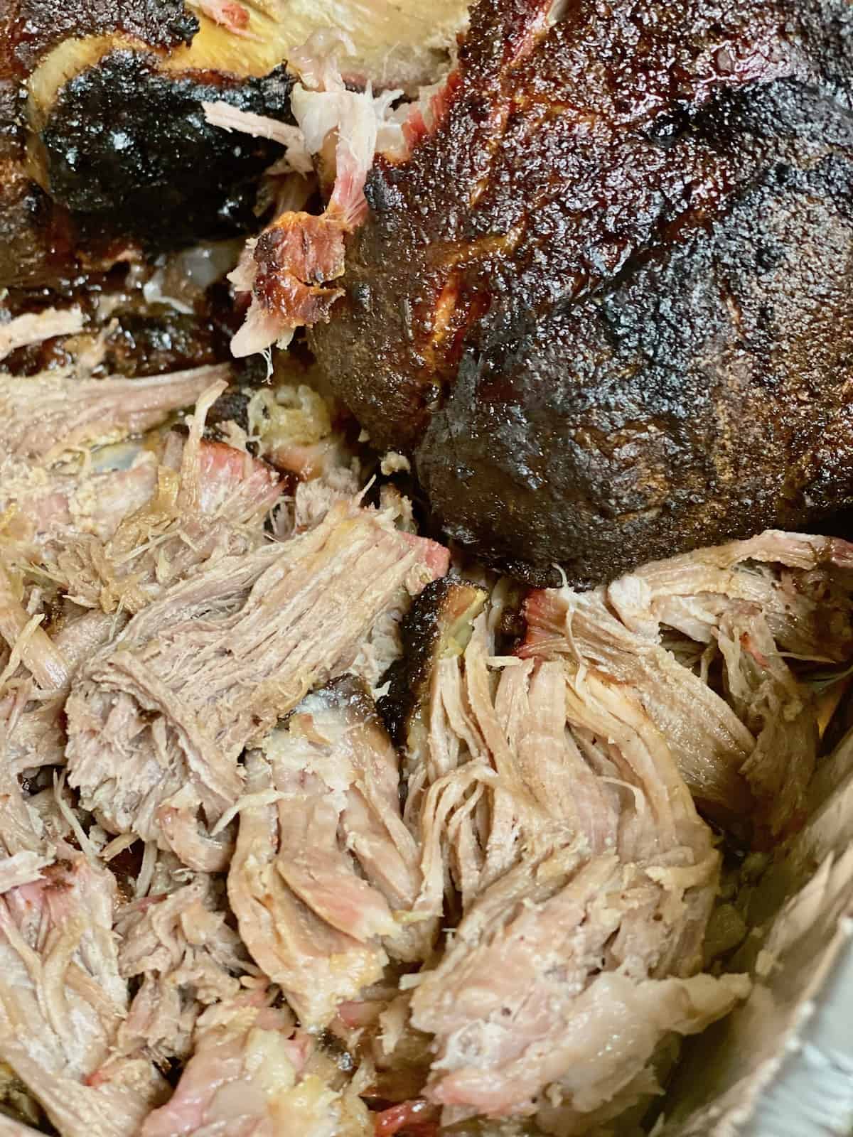 Smoked Pulled Pork Shoulder (pork butt) Closeup of the bark and the shredded cooked pork roast