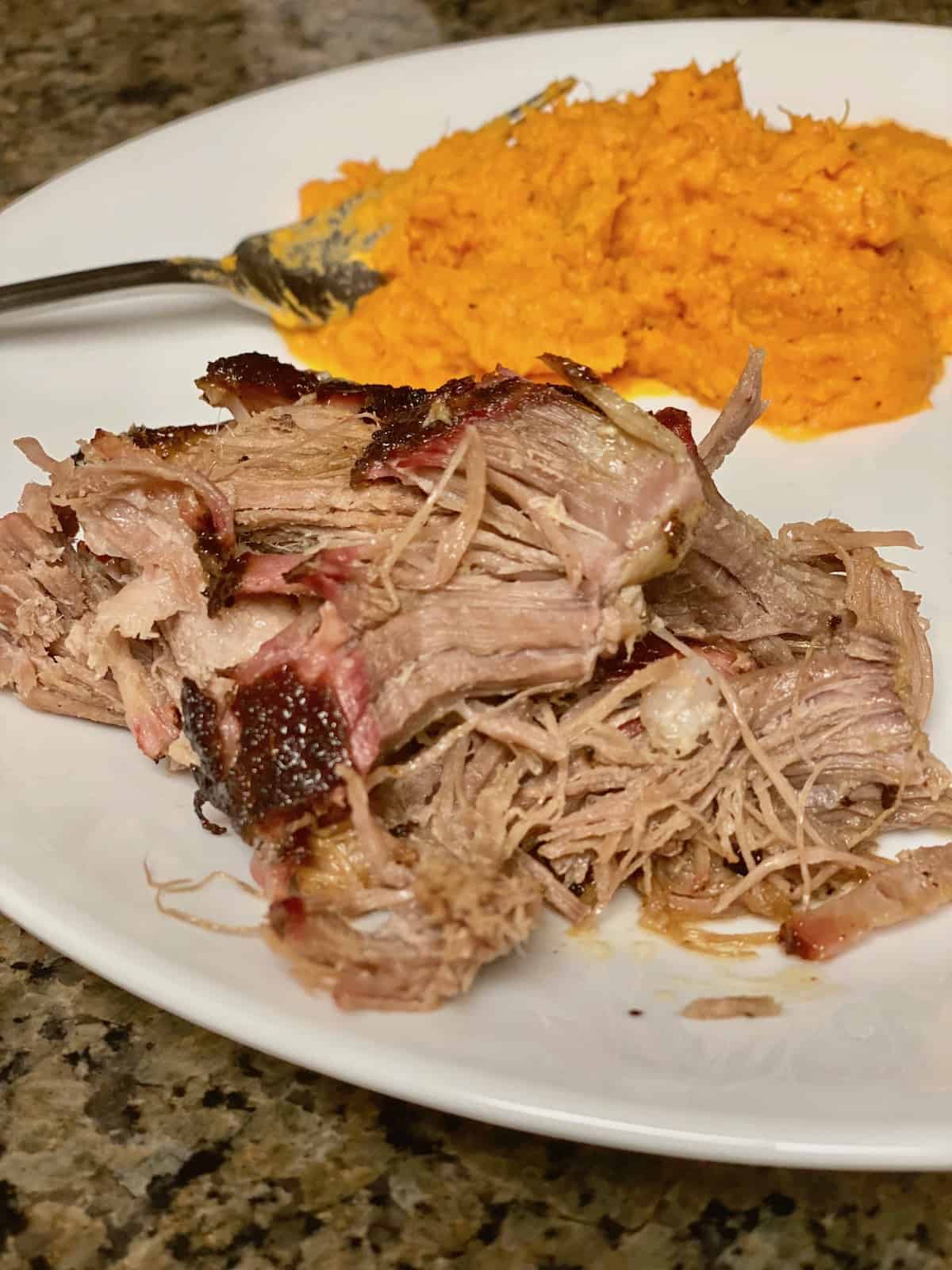 Smoked Pulled Pork Shoulder (pork butt) Plated with Whipped Sweet Potatoes.