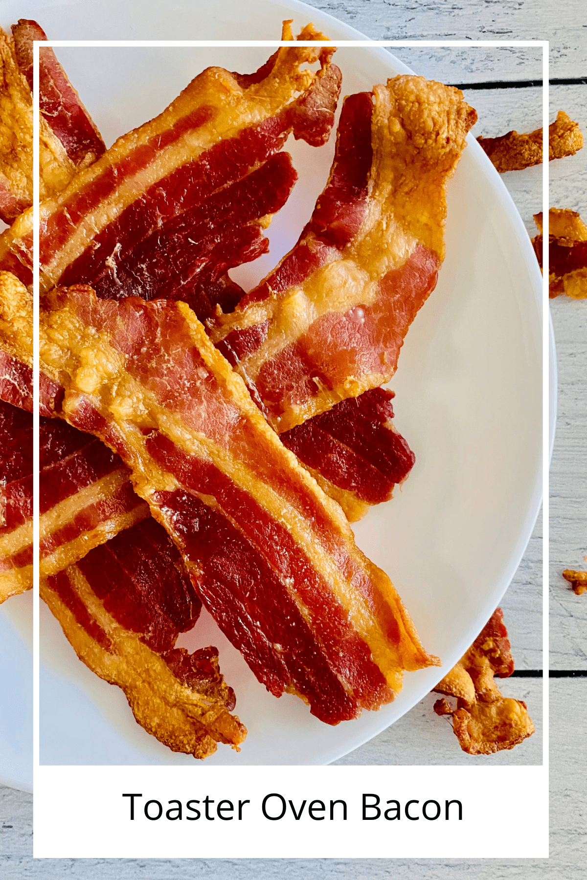 Overhead close-up of toaster oven bacon piled on a plate ready to eat.