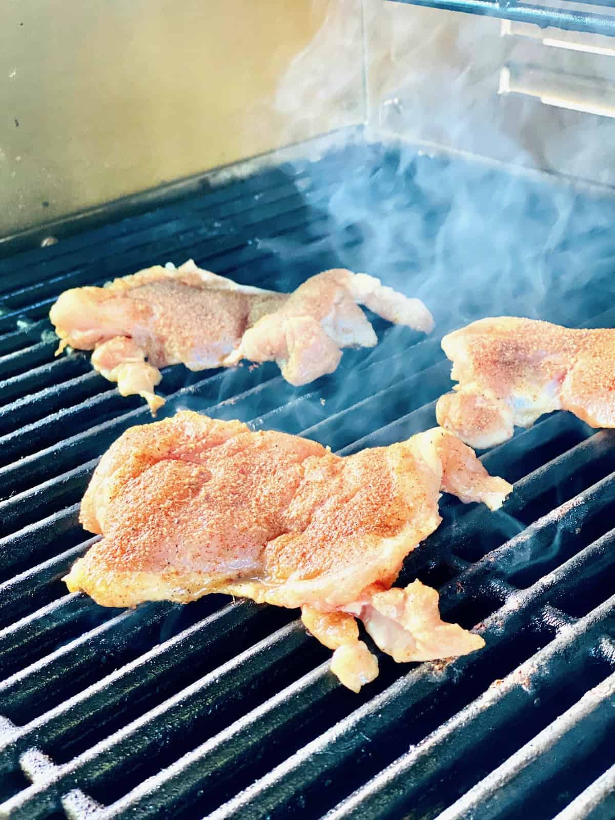 Chicken Thighs just put on the grill to cook.