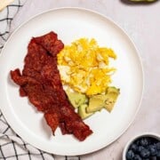 Plated air fryer turkey baacon with eggs and avocado