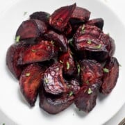 White bowl filled with air fryer beets ready to eat.