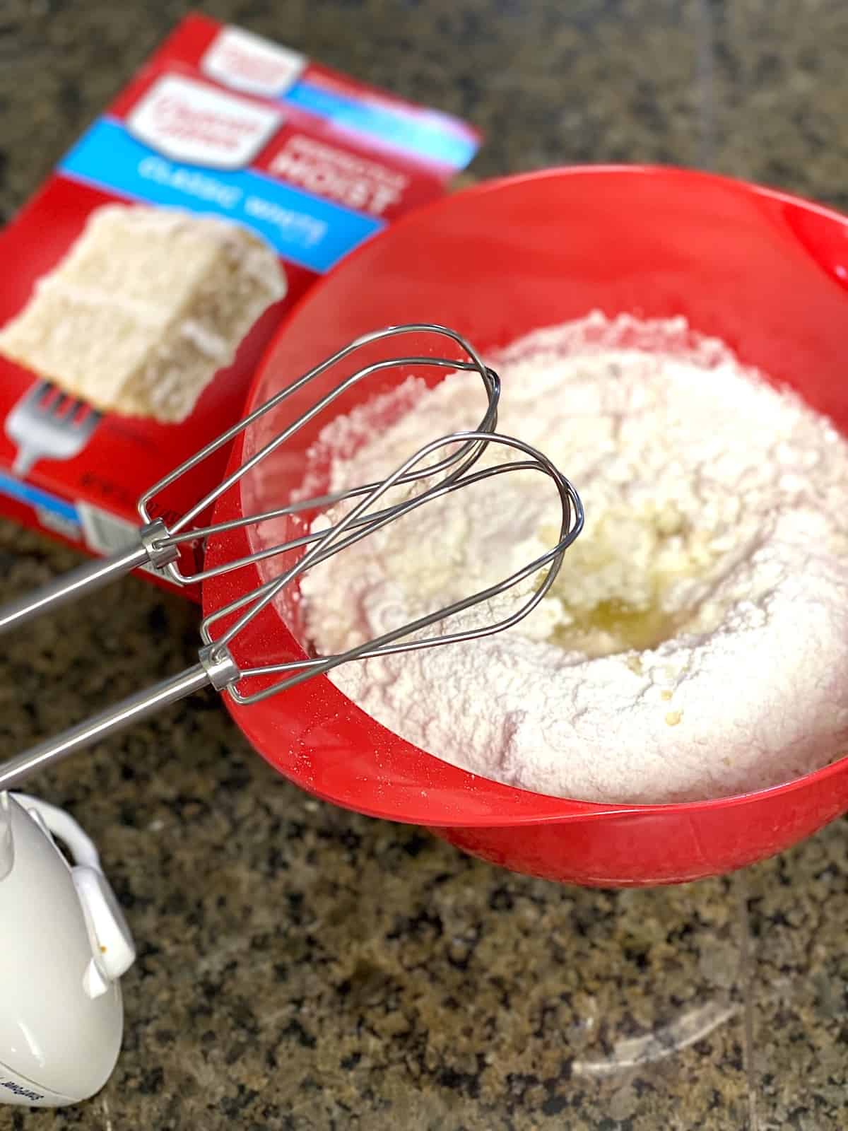  Mixing Bowl filled with cake mix and ingredients.