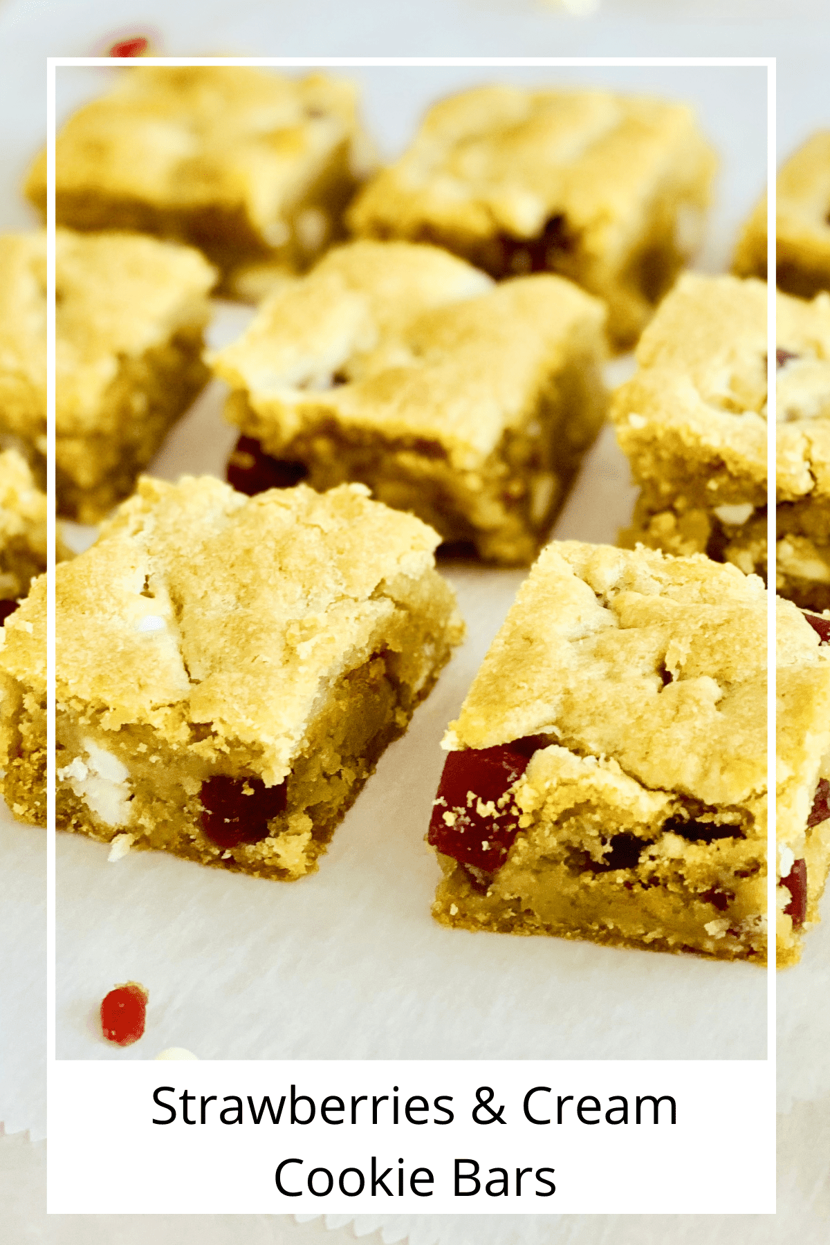 Squares of strawberry and cream morsels cookie bars.