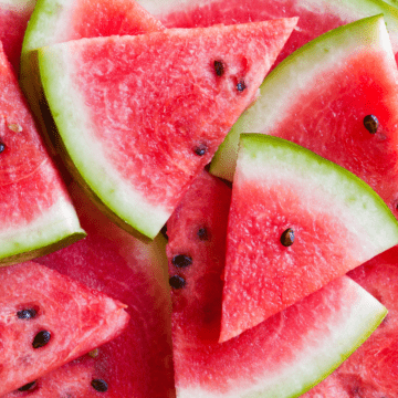 Wedges of watermelon piled up.
