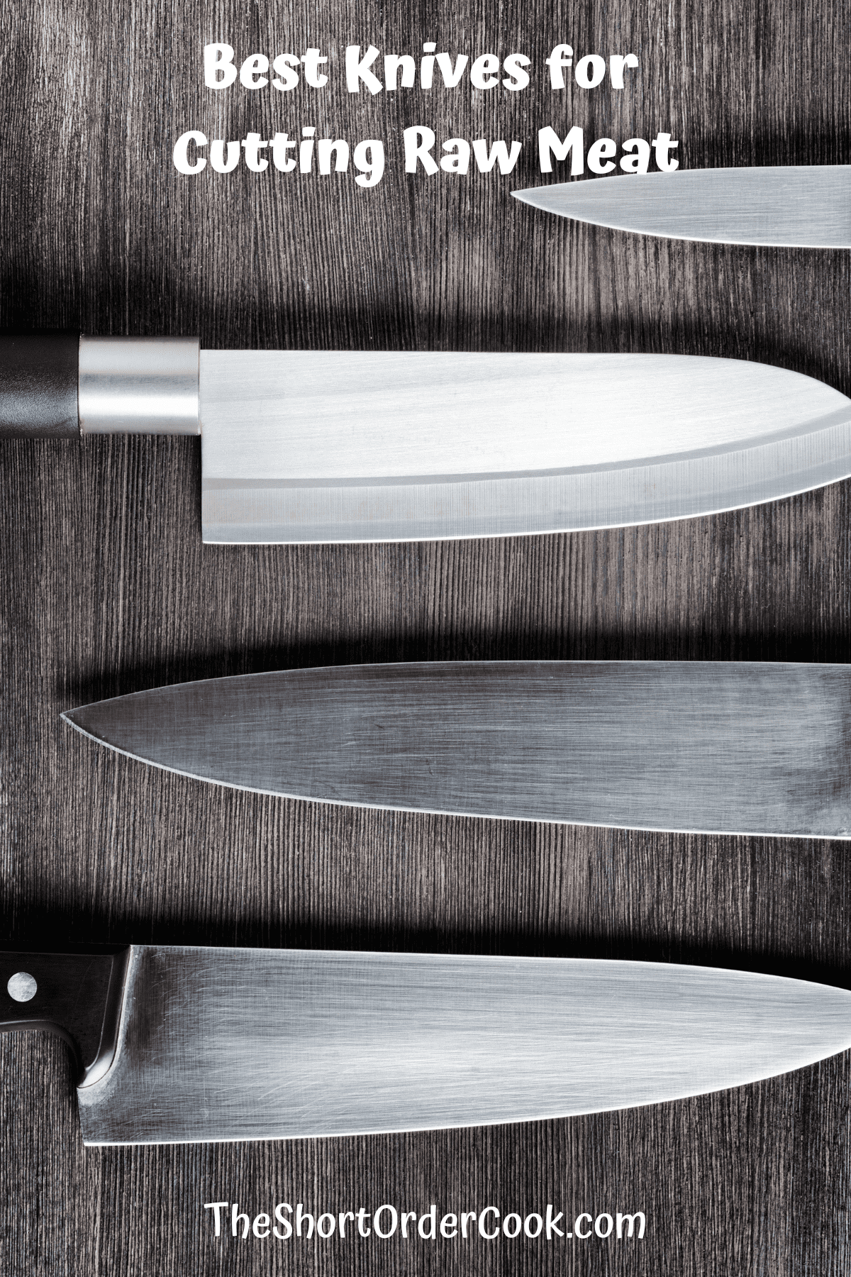 Four knives laying flat on a wooden surface.