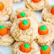 Spice cookies topped with a pumpkin shaped candy.