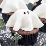Chocolate cupcake with a white fondant ghost on top.