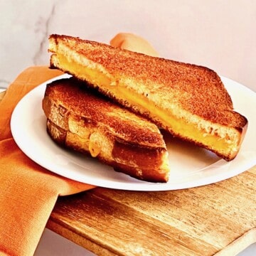 Toasted grilled cheese sandwich plated.