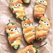 Jalapeno poppers with eyes and looks like mummies wrapped in dough.